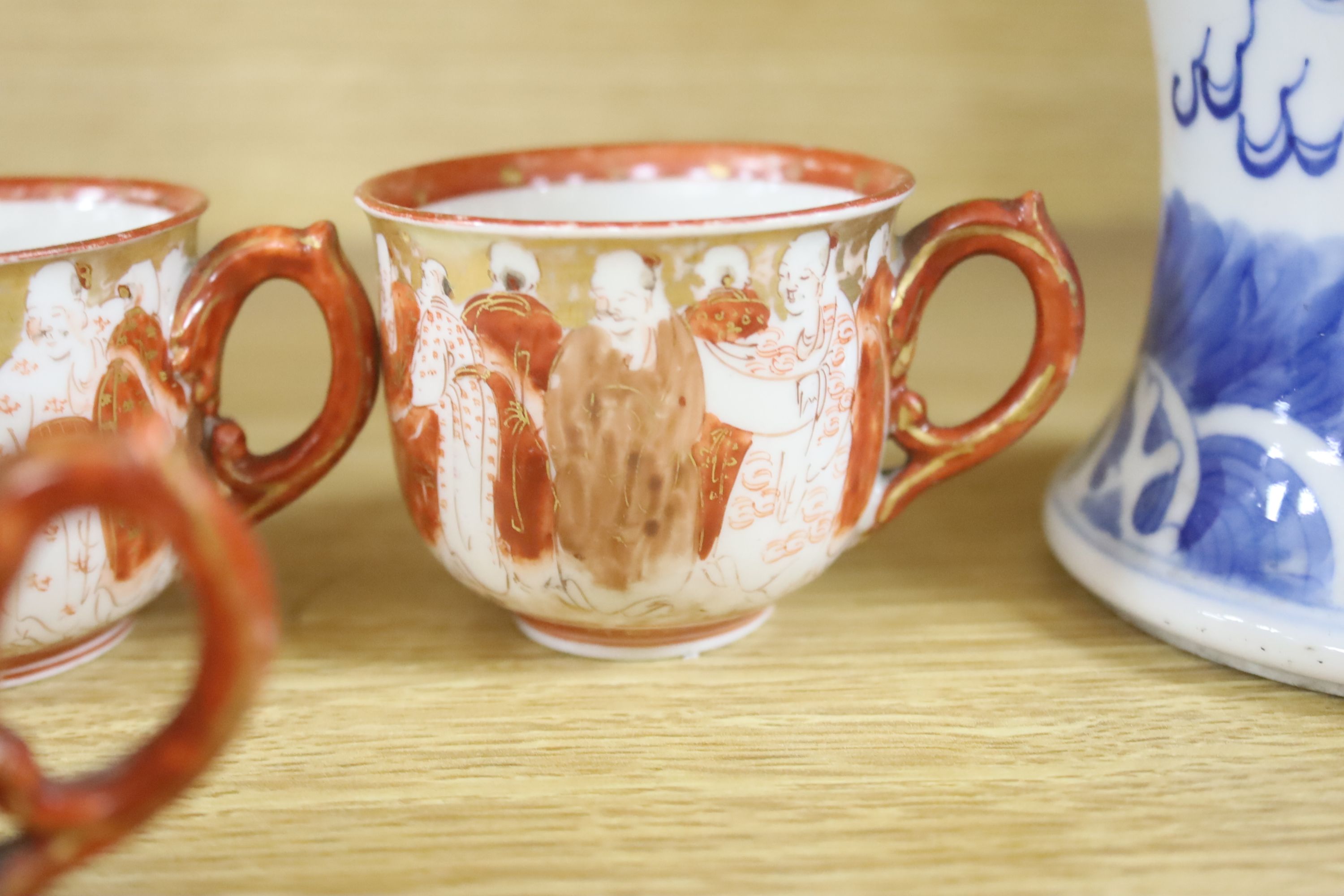 A Chinese blue and white dragon vase, a celadon glazed dish, a blue and white tea bowl and saucer and Kutani wares